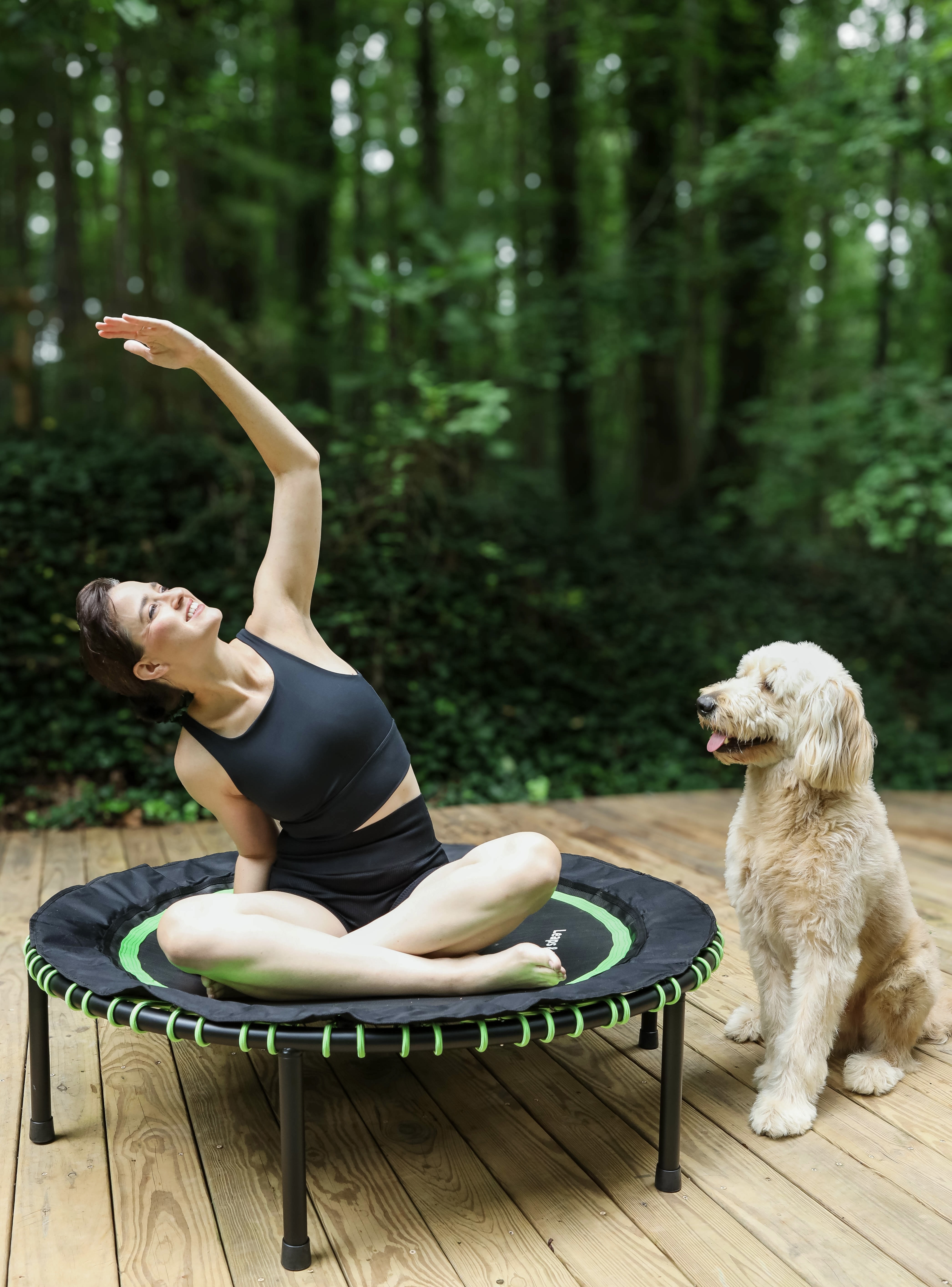Happy athlete bouncing outdoors